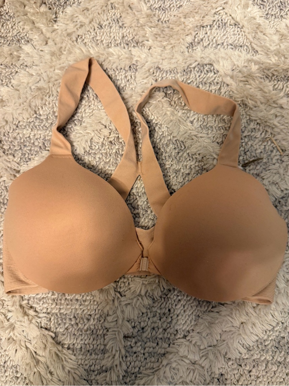 Spanx nude racerback bra with front clip size 34C, has some fuzzies